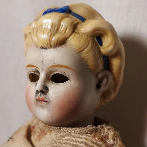 Antique China Head Doll with Blonde Hair & Blue Ribbon in Hair Partial Body
